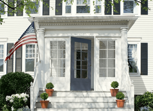 Navy front door on white house with black shutters
