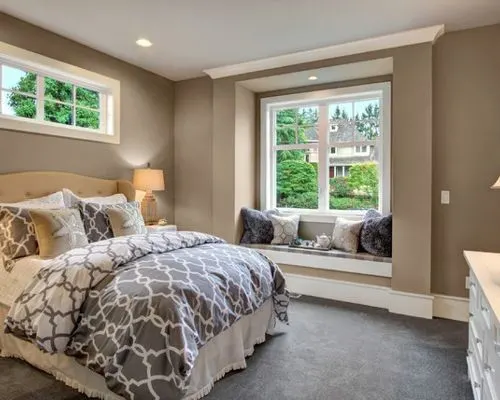 sherwin-williams-requisite-gray painted walls in master bedroom with bed and window seat