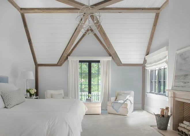 master bedroom with bed and fireplace with walls painted  benjamin moore gray cloud