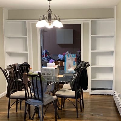 Revere Pewter painted walls in dining room with built in cabinets and dining table