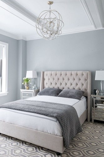 Wall-color-is-Benjamin-Moore-Coventry-Gray. in bedroom with bed