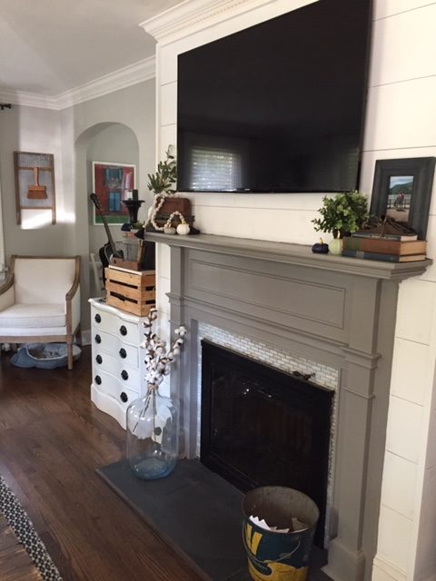 fireplace with tv mounted above it