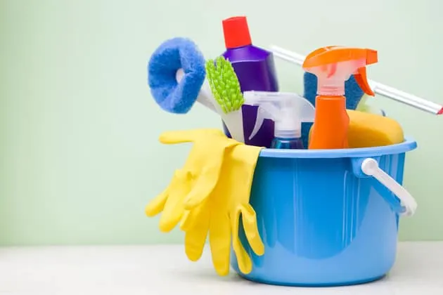 blue bucket with cleaning supplies in it