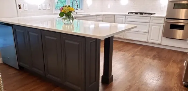 dark Painted kitchen island in kitchen with white cabinets
