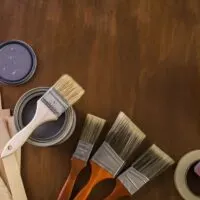 painting tools on a wood floor