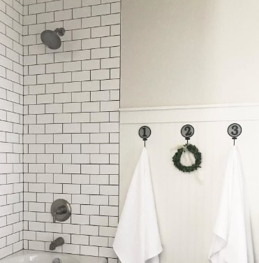 bathroom with swhite subway tile and SW Natural Choice painted Walls