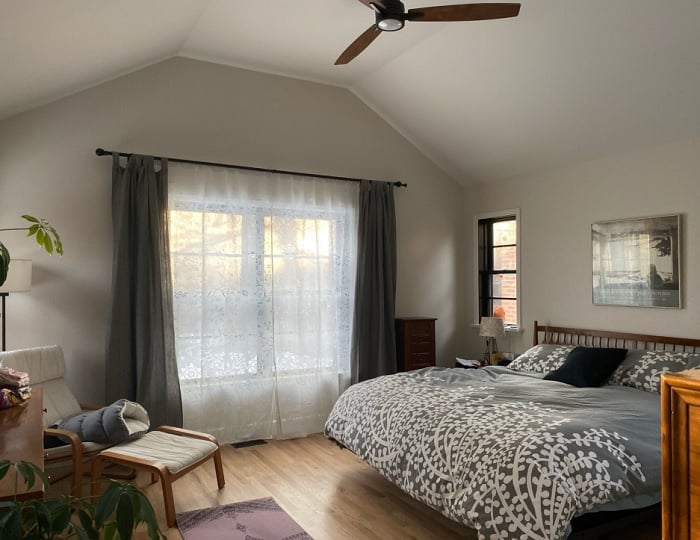 painted Classic Gray Bedroom walls with bed, chair and large window