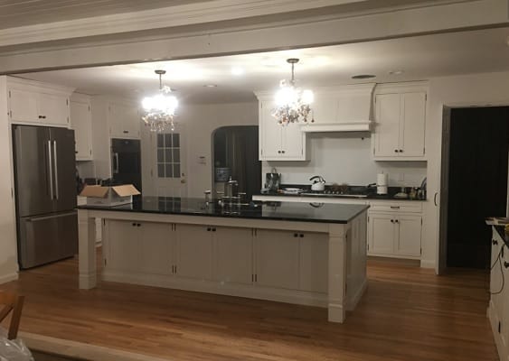 open kitchen with white cabinets