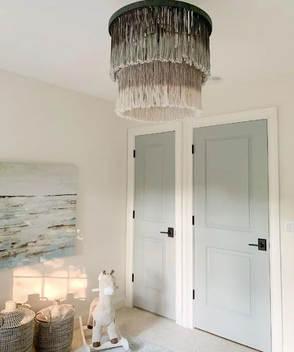 painted Boothbay Gray Doors in nursery with fringed light fixture