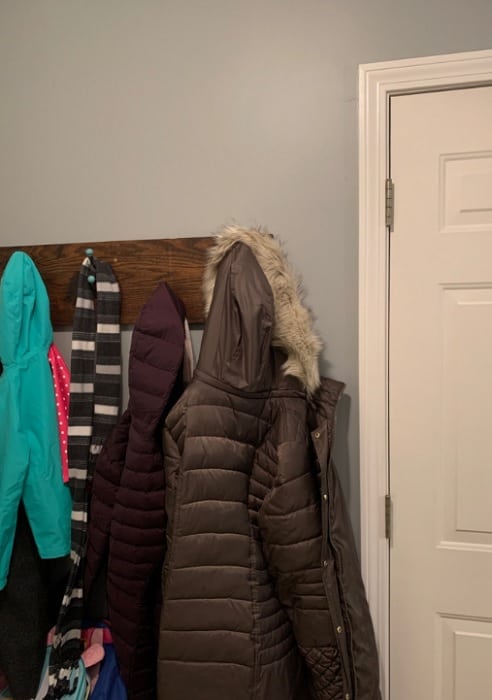 painted Boothbay Mudroom with coat rack and hanging coats
