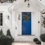royal blue front door on a white house