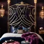 dark feminine bedroom with bed and very large gold headboard