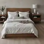 modern bedroom with cozy bed, night stand and artwork in neutral colors