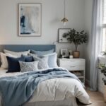bedroom with cozy bed and night stand and artwork in neutral and blue colors