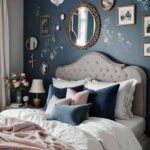 small bedroom with bed and a navy blue accent wall