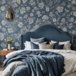 blue bedroom with floral wallpaper and bed