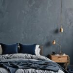 bed with blue bedding and blue wall