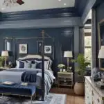 traditional bedroom with dark blue walls and accents