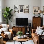 A small modern living room with Antique and vintage accents, camel colored couch and chairs