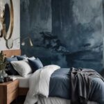 moody blue bedroom with bed and blue accent wall