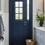 Bathroom with navy blue door and trim