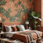 Bedroom with a natural rustic wood bench, botanical wallpaper and terracotta tones