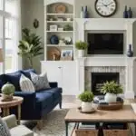 Living room with fireplace, sage green walls, wood coffee table, and navy and green couches