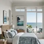 a coastal style bedroom with a bed that has a balcony.