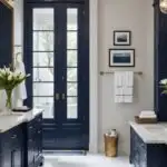 large luxurious Bathroom with white towels and a few navy blue accents