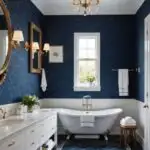 large luxurious Bathroom with white towels and a navy blue wallpaper