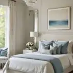 bedroom with bed, night stand, cream walls , floor to ceiling window