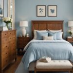 bedroom with bed, night stands , blue walls and wood dresser