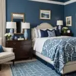 blue guest bedroom with night stands, lamps and a chair