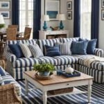 coastal living room with blue and white striped couch, square coffee table and blue curtains on windows