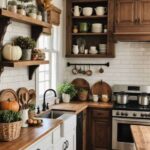 farmhouse kitchen with earthy brown and green autumn decor and white and wood cabinets