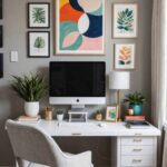 home office with white desk, gray chair and colorful art on the wall