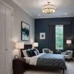 _large guest bedroom with bed, night stands, wall art and two chairs in front of a window