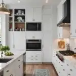 large kitchen with classic white walls and cabinets