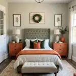 large neutral farmhouse style Bedroom with burnt orange and green details