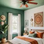 neutral boho Bedroom with a green ceiling fan and green and burnt orange room details