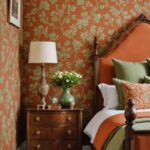 neutral traditional Bedroom with burnt orange and green wallpaper and walnut furniture