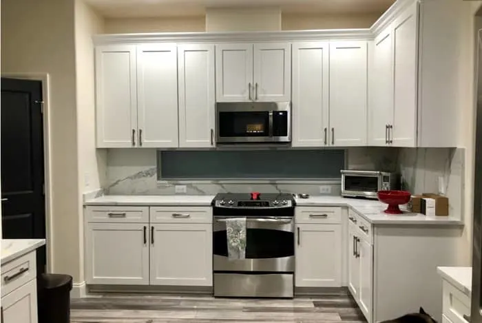 painted Decorator's White Cabinets in a small kitchen 