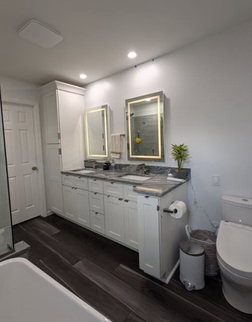 bathroom walls painted in Decorators white, double vanity and dark floors