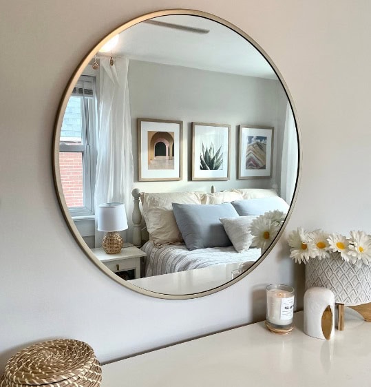 Eider White on walls of bedroom with round mirror