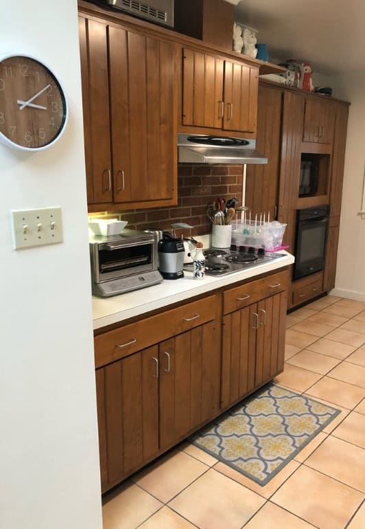 White painted on kitchen wall in kitchen with wood cabinets