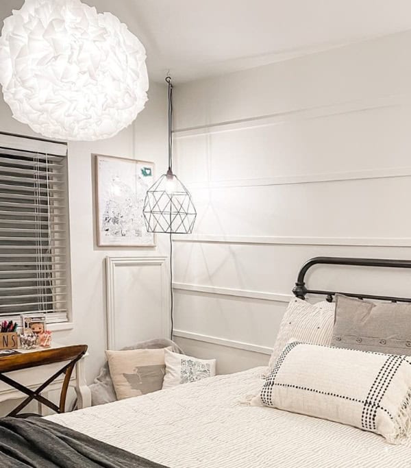 bedroom with bed, ikea light fixture and White  panted walls