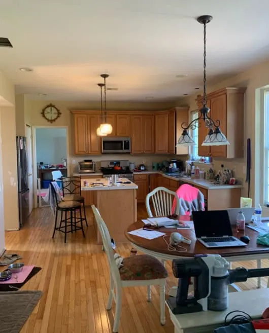 combined dining room and kitchen with honey oak cabinets