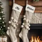 A living room with neutral beige Christmas Stockings that are linen, burlap, or chunky knit in cream, beige, or light gray