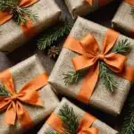 Christmas presents wrapped with burlap ribbons, dried orange slices, or sprigs of greenery