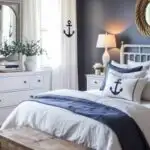 Nautical style Bedroom with bed, navy blue walls, art on the wall, and window